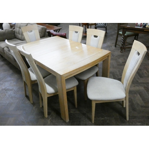 85 - Modern light oak extending dining table and six matching high back chairs with fawn upholstery