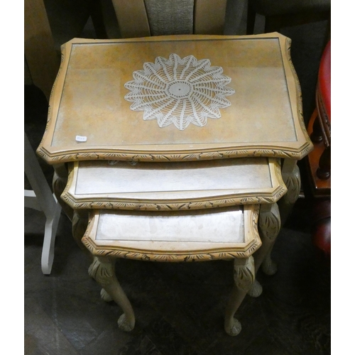 96 - A nest of three bleached oak coffee tables on cabriole legs with inset glass tops