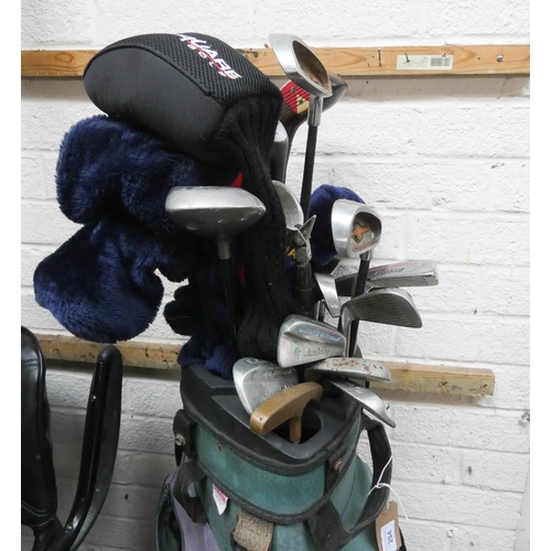 294 - A set of old golf clubs and a quantity of metal woods