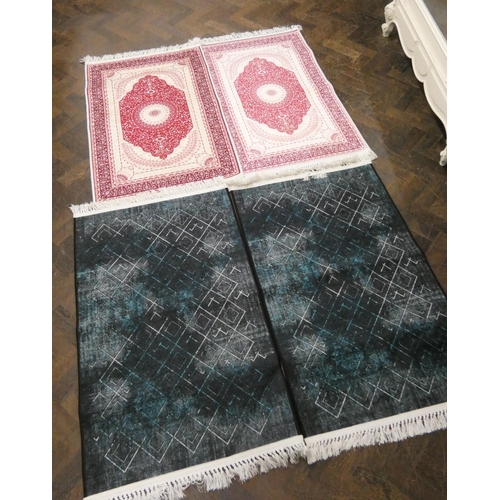 186 - Pair of pink rugs and a pair of dark blue rugs