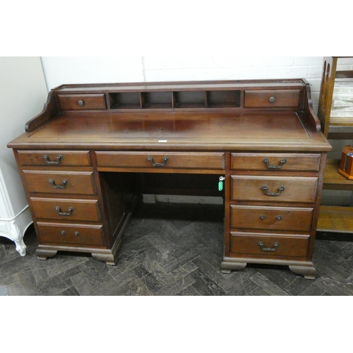 219 - A mahogany kneehole desk, fitted nine drawers with small back fitted partitions and drawers, 5' wide