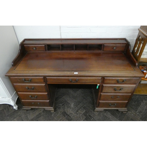 219 - A mahogany kneehole desk, fitted nine drawers with small back fitted partitions and drawers, 5' wide