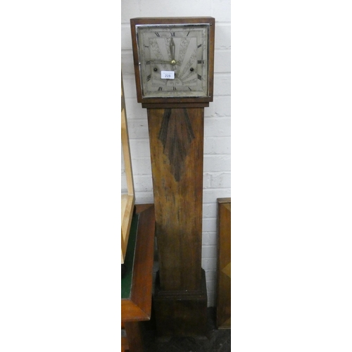 228 - A Westminster chiming Grandmother clock in a walnut case