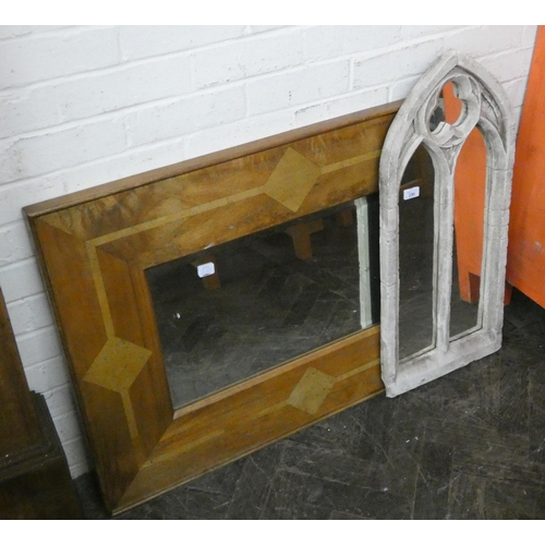 230 - A bevelled mirror in hard wood frame and a Gothic style mirror in white painted frame