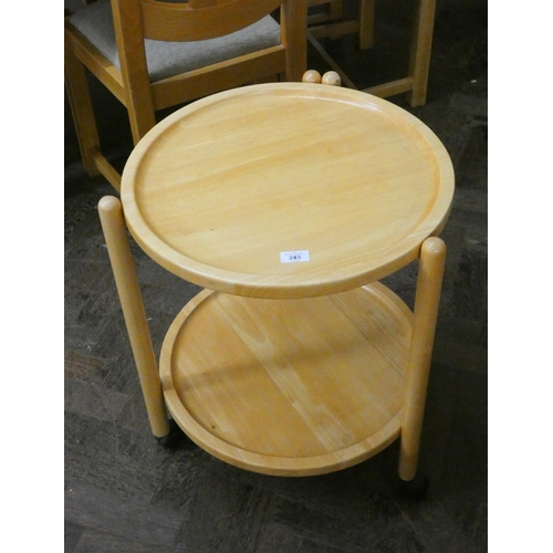 245 - Circular light beech two tier trolley table,