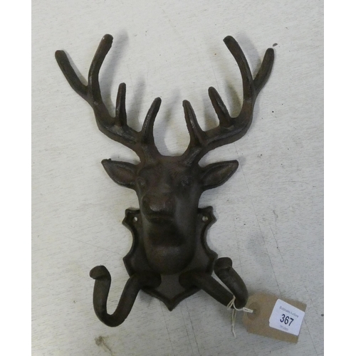 367 - A Stags head wall hanging cast iron double coat hanger