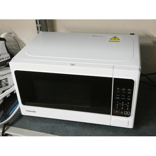 395 - A very clean Toshiba microwave oven in white case