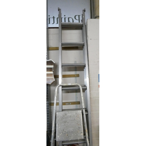 417 - A nine rung double extending aluminium ladder and a folding aluminium step ladder