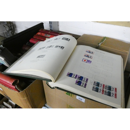 429 - Two large boxes of stamps, mostly in albums and a quantity of new unused stamp albums