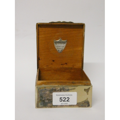 663 - A square vintage cigarette box, the hinged lid opening to reveal hallmarked silver badge 'To Steve f... 