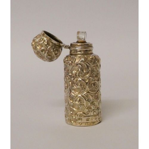 676 - A Victorian silver scent flask with embossed decoration, original stopper, in fitted box, maker Char... 