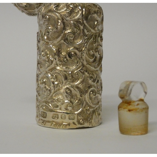 676 - A Victorian silver scent flask with embossed decoration, original stopper, in fitted box, maker Char... 