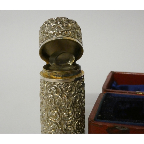 680 - A Victorian silver mounted scent flask in embossed case, Chester hallmarks 1896, makers mark George ... 