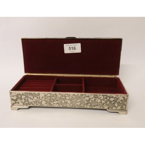 655 - A silver plated rectangular jewellery box, with hinged lid and fitted red velvet interior. 23 cms ac... 