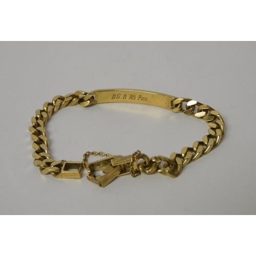 532 - 9ct yellow gold identity bracelet, hallmarked, with safety chain. Weight 20.9g