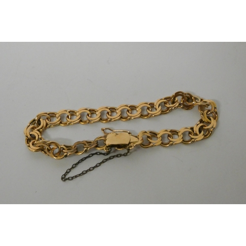 543 - A scrolled chain bracelet, foreign hallmarks, tests as 18ct gold. Weight 20.3g