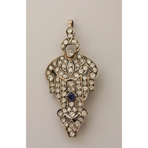 551 - Art Deco sapphire and diamond pendant brooch, circa 1930, the openwork stylised shield-shaped pendan... 