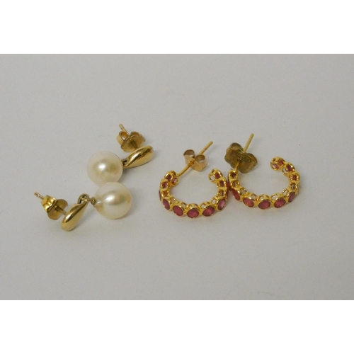 556 - Pair of ruby huggie style hoop earrings in yellow metal and a pair of 9ct gold and cultured pearl dr... 