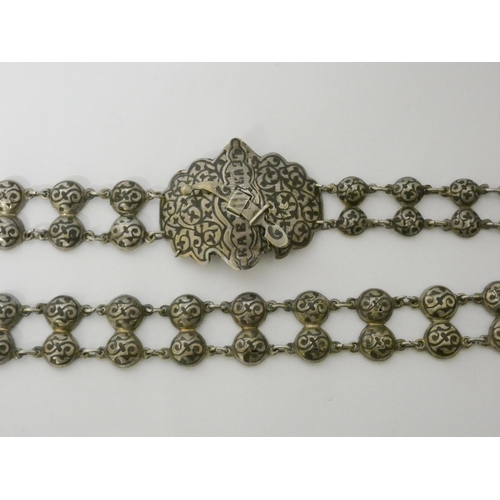 600 - A late 19th century Russian silver and niello waist belt and buckle, 70cms long approx, marked. 132g