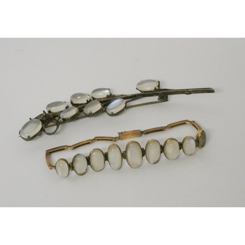 603 - Antique moonstone bracelet in yellow metal and a white metal moonstone spray brooch.