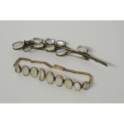 603 - Antique moonstone bracelet in yellow metal and a white metal moonstone spray brooch.