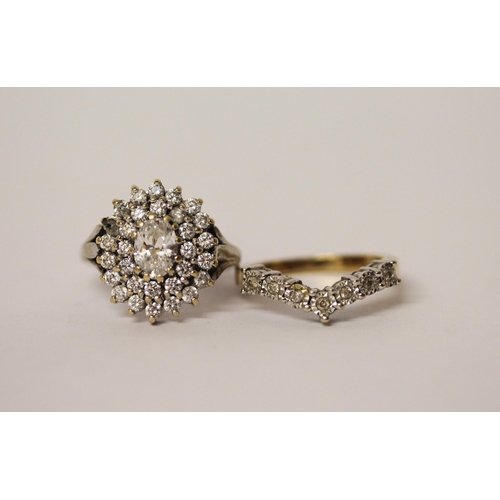 604 - 9ct white gold oval cluster dress ring and a wishbone ring set with small diamonds on 9ct gold band.... 