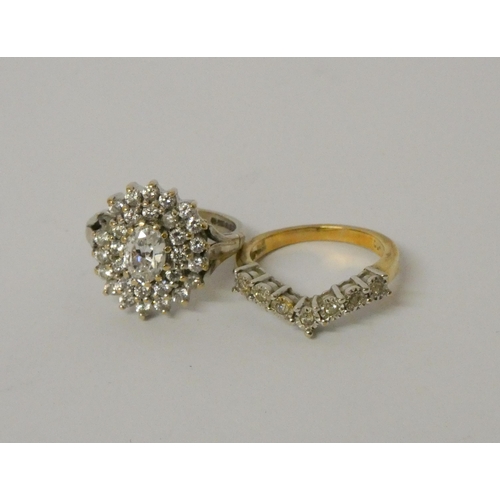 604 - 9ct white gold oval cluster dress ring and a wishbone ring set with small diamonds on 9ct gold band.... 