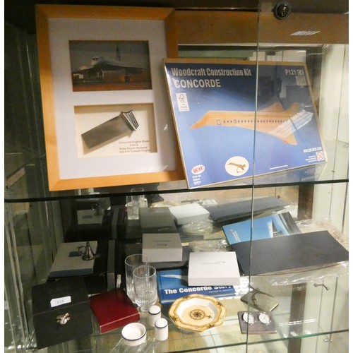 318 - A large collection of Concorde memorabilia to include photographs, construction kit, dishes, paperwe... 