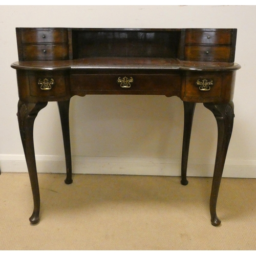 30 - Mahogany kidney shaped desk on cabriole legs in the Carlton House style, 42