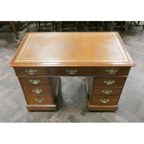 35 - Victorian  mahogany kneehole pedestal desk fitted nine drawers and brown leather to the top, 42