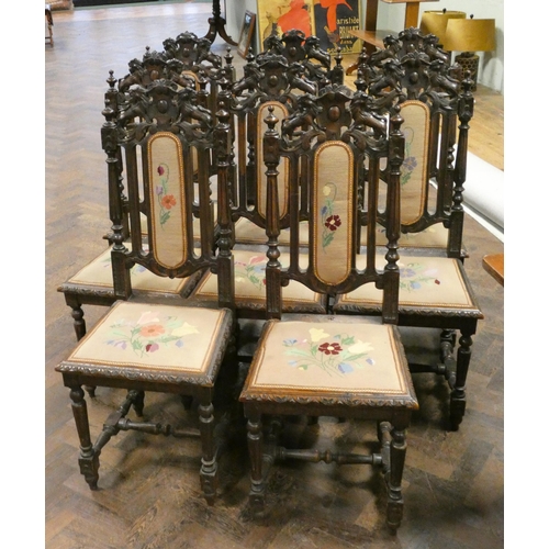 61 - Long oak refectory style dining table and a set of eight Cromwellian style carved oak dining chairs.... 