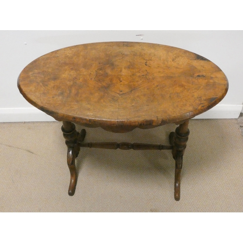 67 - Oval Victorian walnut occasional or centre table on a stretcher style base, 33