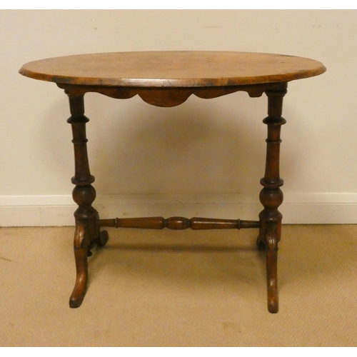 67 - Oval Victorian walnut occasional or centre table on a stretcher style base, 33