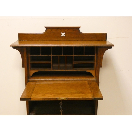 78 - Arts & Crafts Harris Lebus oak students bureau with shelves under. 2'9