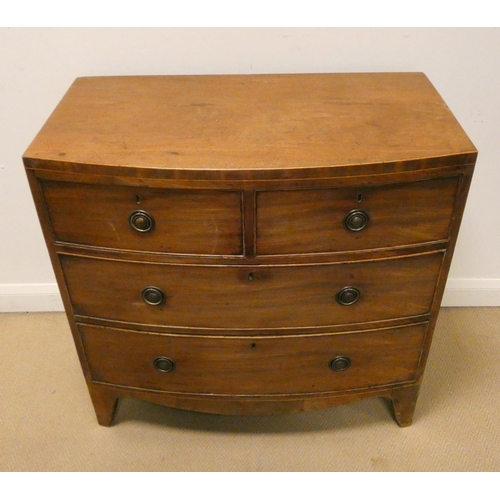 9 - Late Georgian mahogany bow fronted chest of two long and two short drawers standing on splayed feet.... 