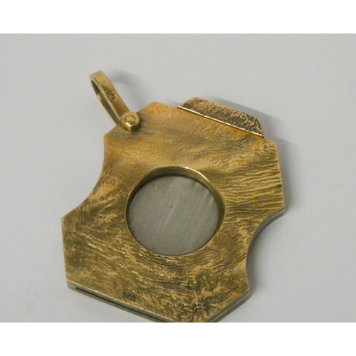 504 - A 9ct gold and steel cigar cutter, marked 9ct.