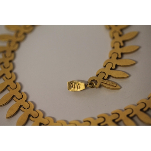 507 - An 18ct yellow gold feather fringe necklace. Length 44cms. hallmarked 750, weight 31 grams