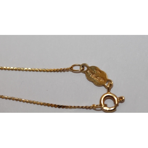 508 - A Ceylonese gold ring and an 18ct gold necklace, both set with white stones. Gross weight 11.3 grams