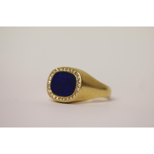 511 - A modern 18ct lapis lazuli and diamond oval panel signet style ring, shank marked 18k, ring size T. ... 