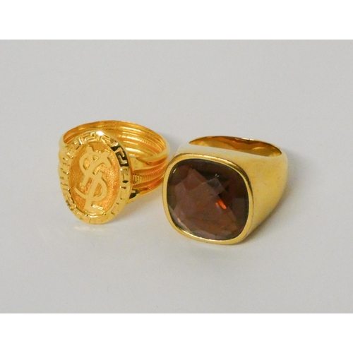 515 - Middle Eastern gold ring and a Swarovski panel gilt  metal ring.