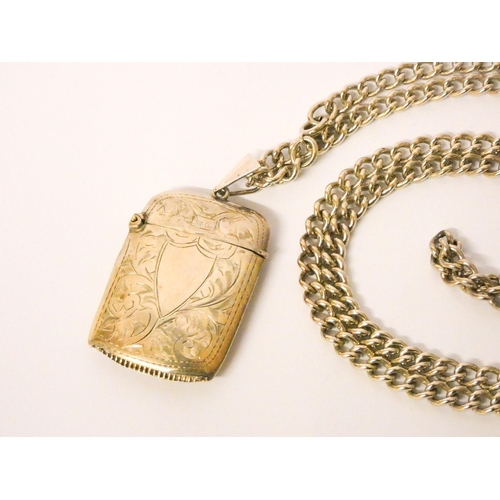 595 - A silver vesta case, mounted on a long silver chain. Gross weight 75g approx.