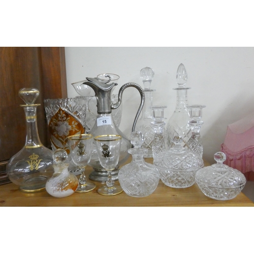 15 - A collection of crystal and cut glass vases, dressing table pieces, decanters, scent bottle etc