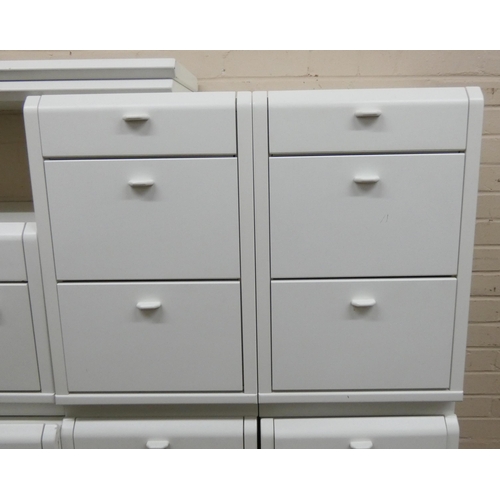 36 - Modern white finished bedroom suite - of various chests of drawers, bedside cabinets and a dressing ... 