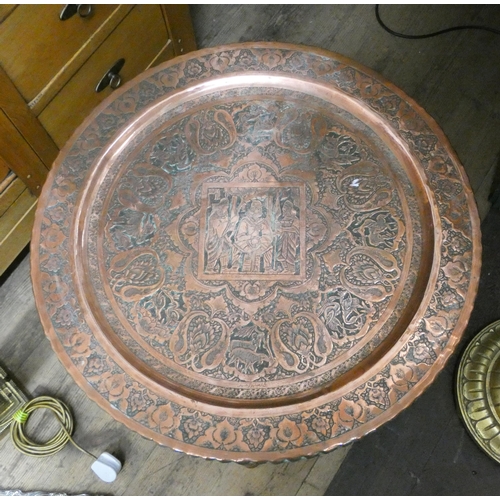 43 - Eastern style copper tray topped tiffin table on folding base