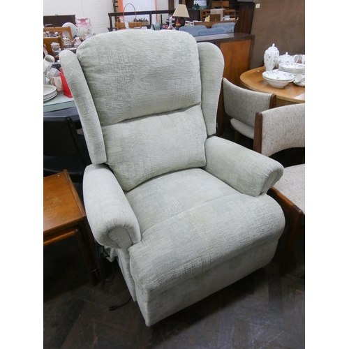 82 - Sherborne electric rise and recline easy chair in pale green