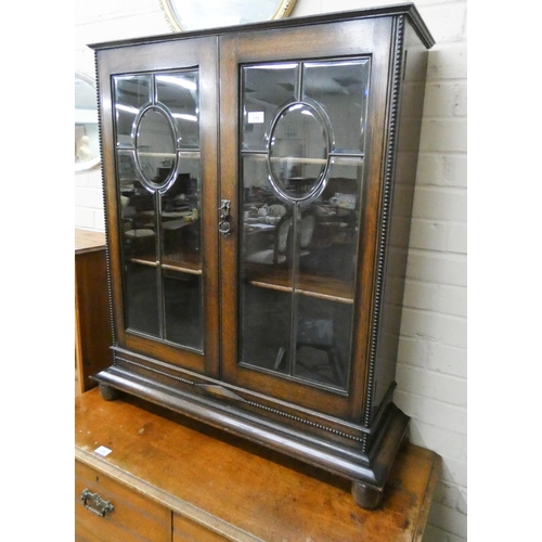 178 - Oak two door glazed bookcase with bevelled glazed doors, 2'9