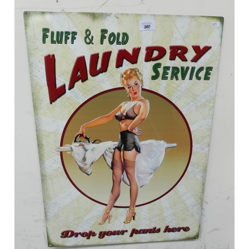 300 - A painted metal advertising sign 'Fluff & Fold Laundry Service'