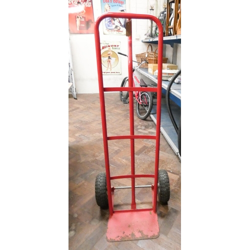 321 - Set of old red sack trucks