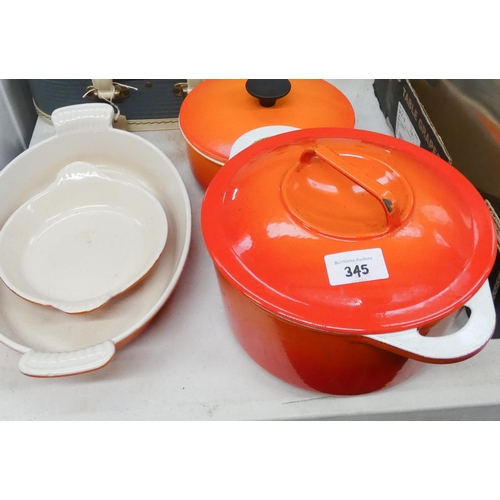 345 - Le Creuset style cast iron saucepan with lid, casserole dish with lid and two further dishes