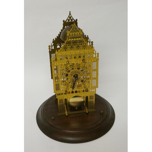 262 - An architectural style brass skeleton clock beneath glazed dome